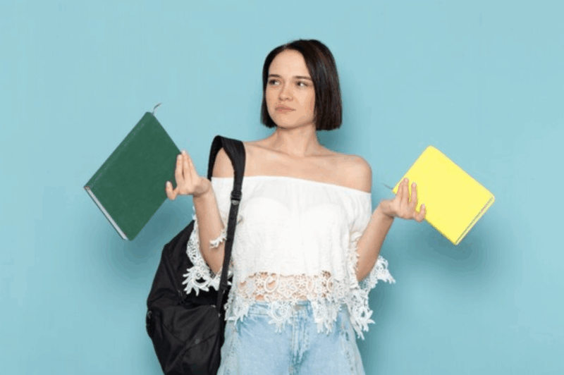 woman with two papers in her hand
